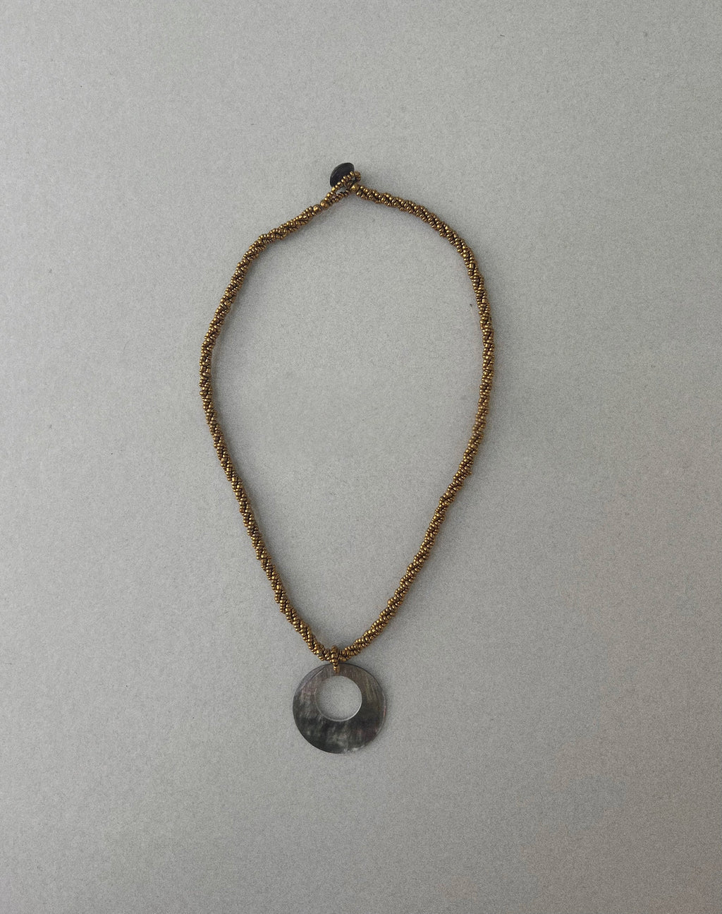 Arma Necklace with Round Shell Pendant in Gold